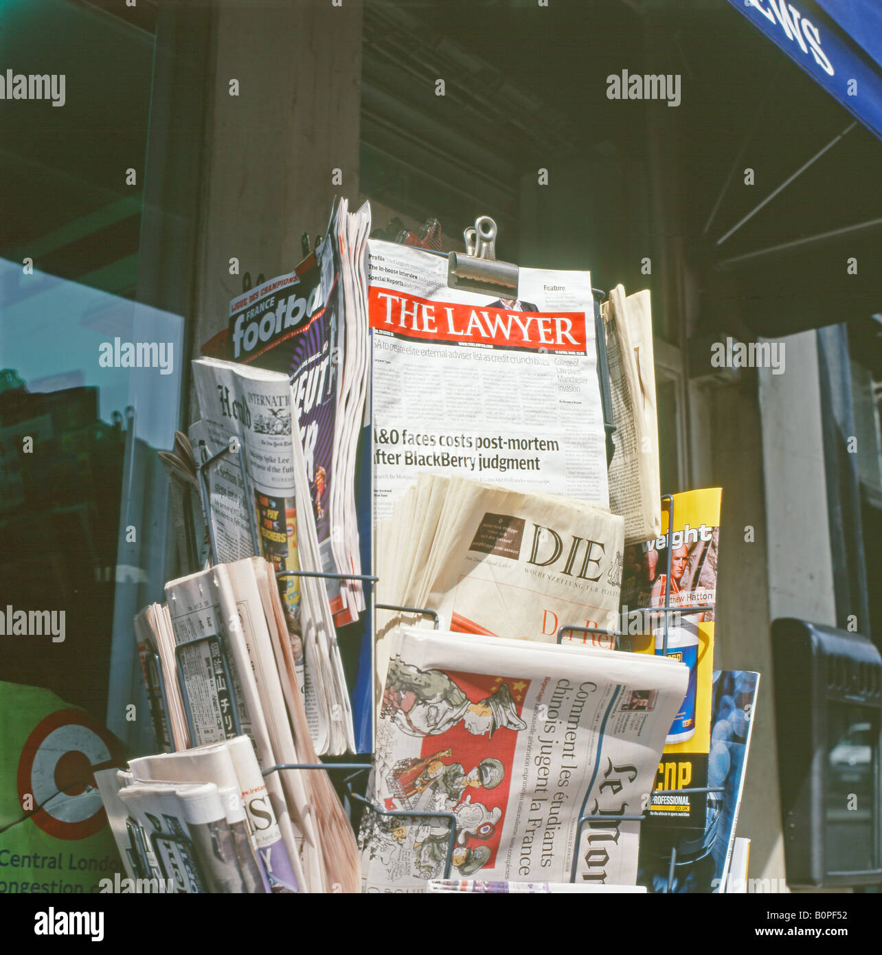 Newspaper stand with The Lawyer publication London England UK Stock Photo
