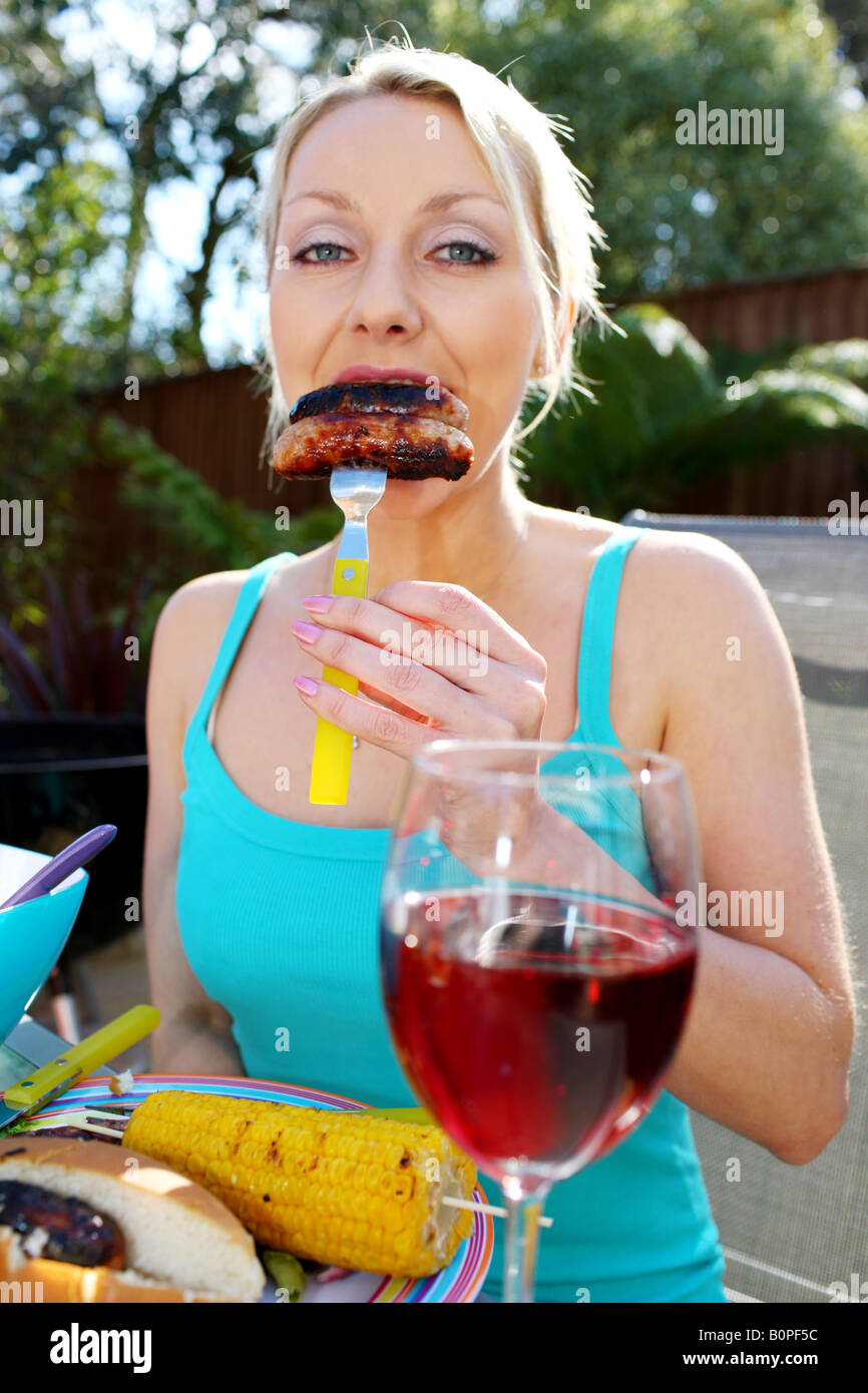 Young Woman Eating Sausages Model Released Stock Photo Alamy