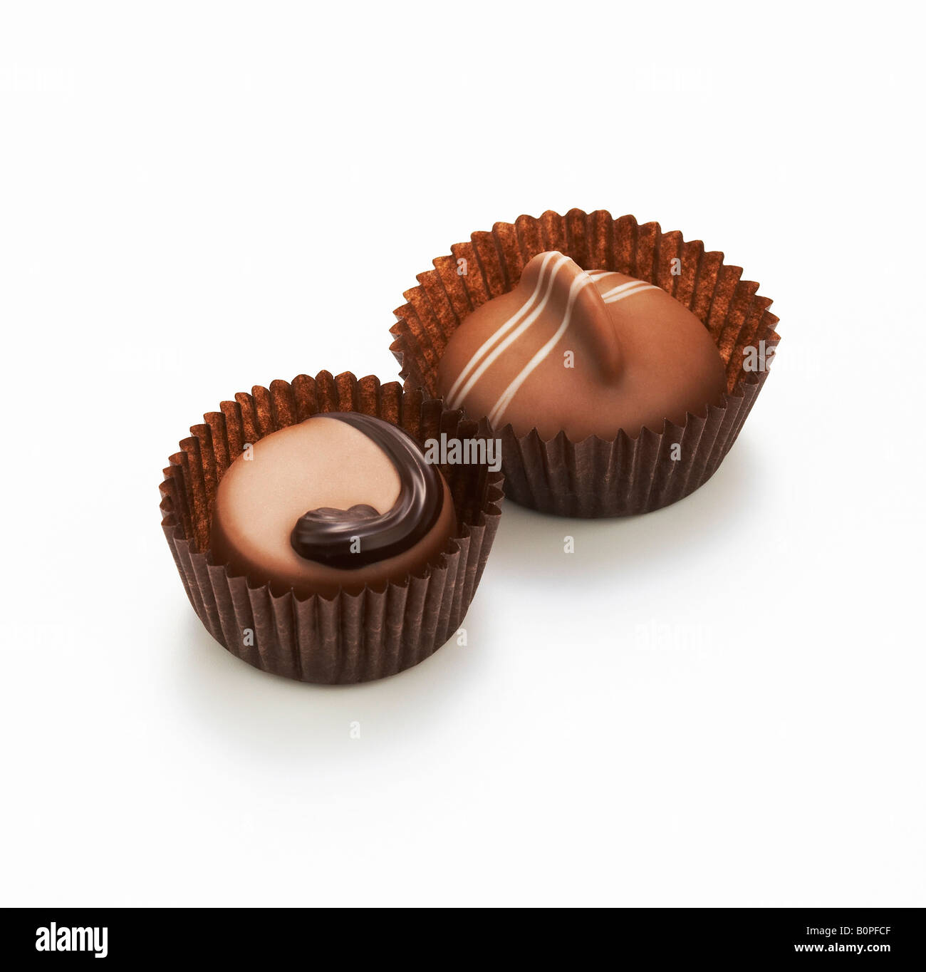 two chocolates in paper cups Stock Photo - Alamy