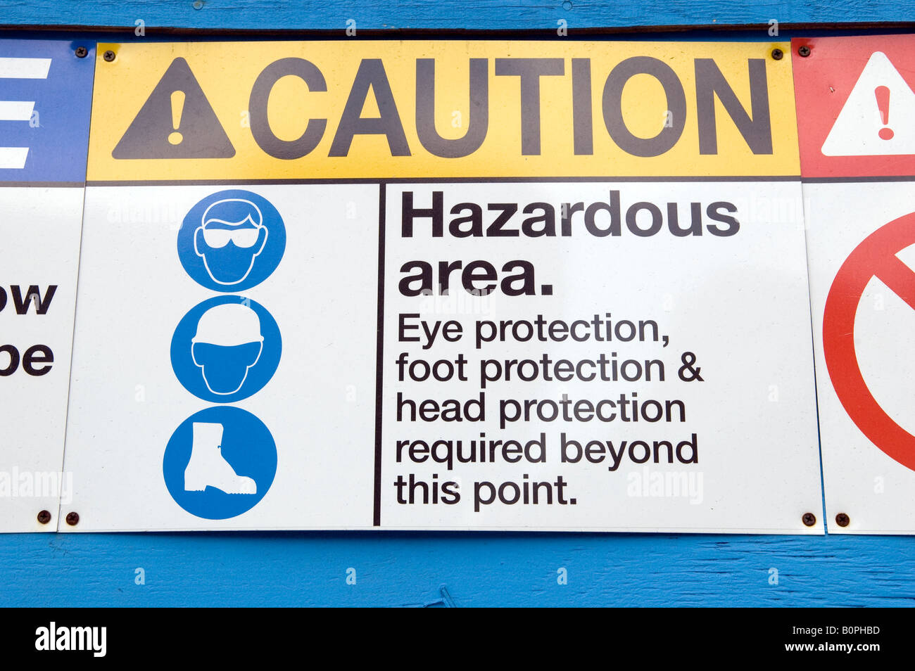 Various safety reminder signs at a construction site in New York Stock Photo