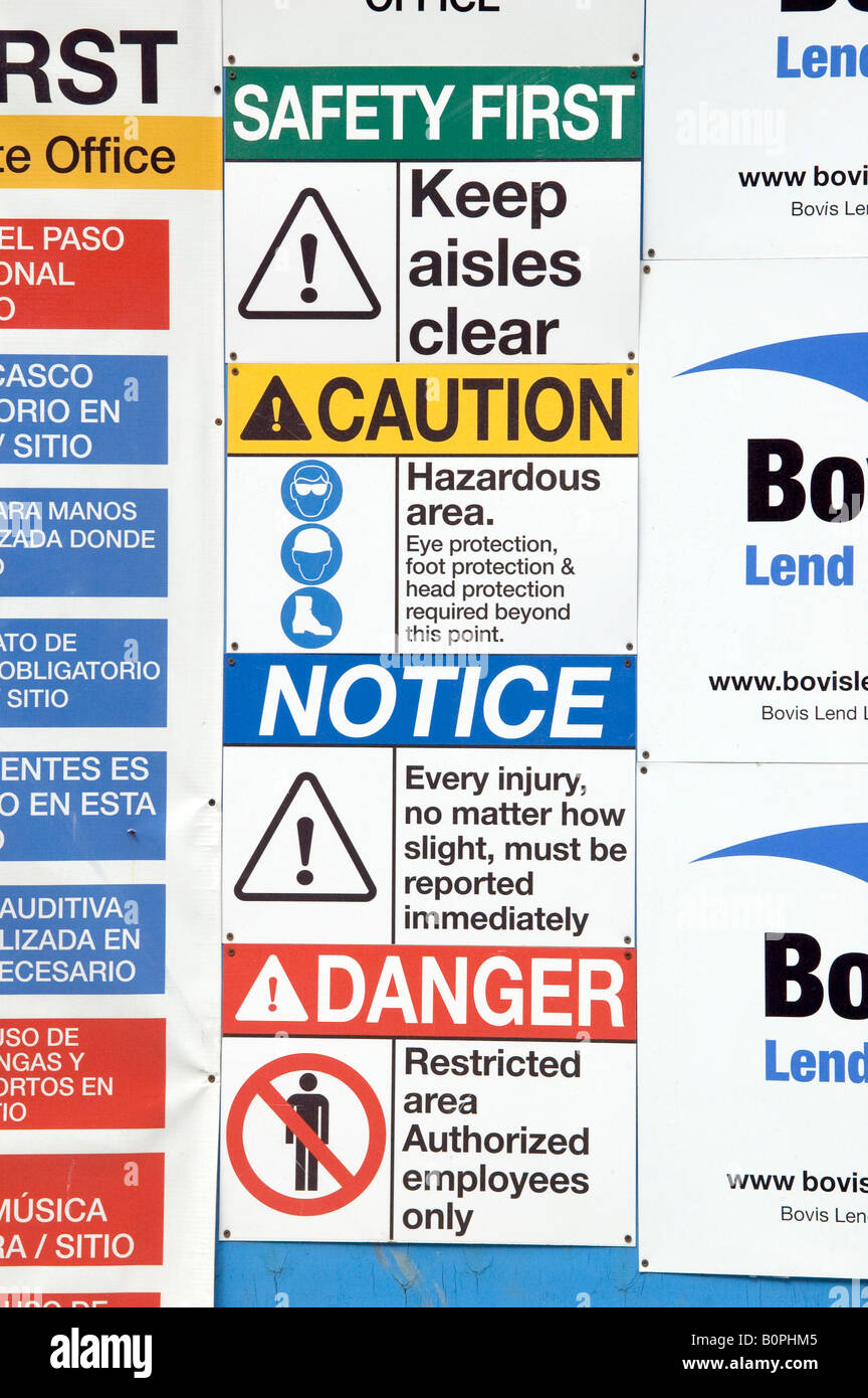 Various safety reminder signs at a construction site in New York Stock Photo