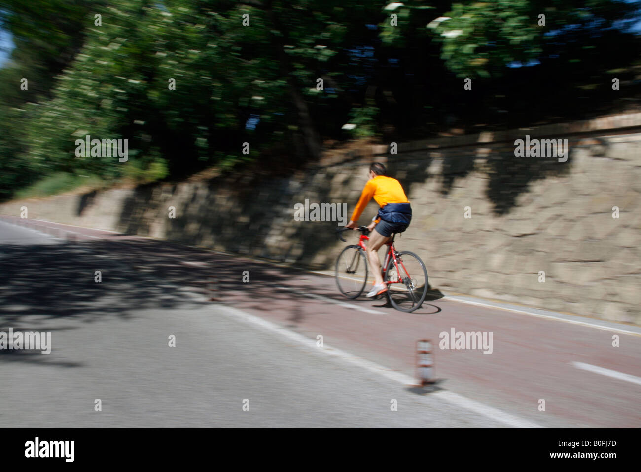 one fast bike rider in countryside Stock Photo - Alamy