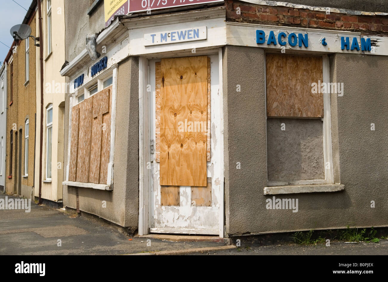 Corner shop boarded up rural economy recession Family Butchers  shops closed down, Sutton Bridge Lincolnshire UK 2008 2000s HOMER SYKES Stock Photo