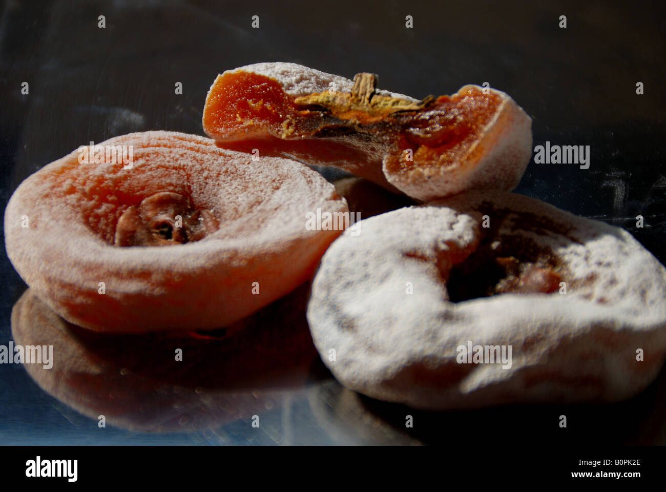 dired persimmon:The viviparus persimmon does caky food which coolly compressing becomes Stock Photo