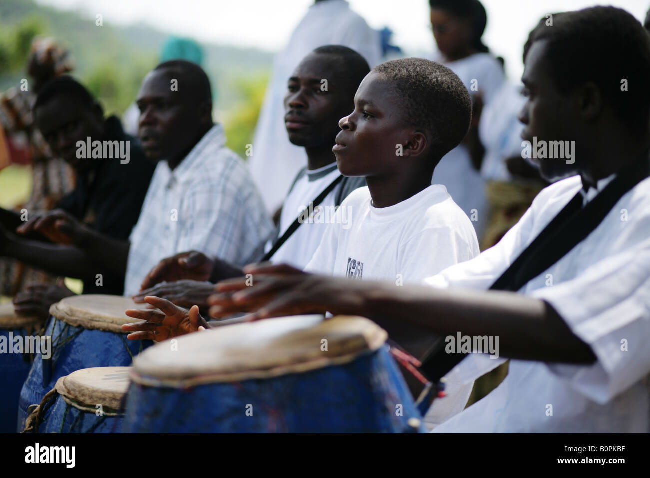 A boy plays the drums during a ceremony in the village of Agbenoxoe