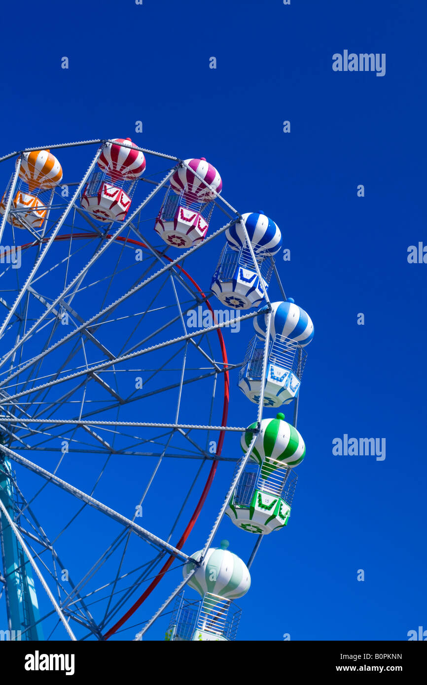 Fairground Ferris wheel photographed against a blue sky Stock Photo