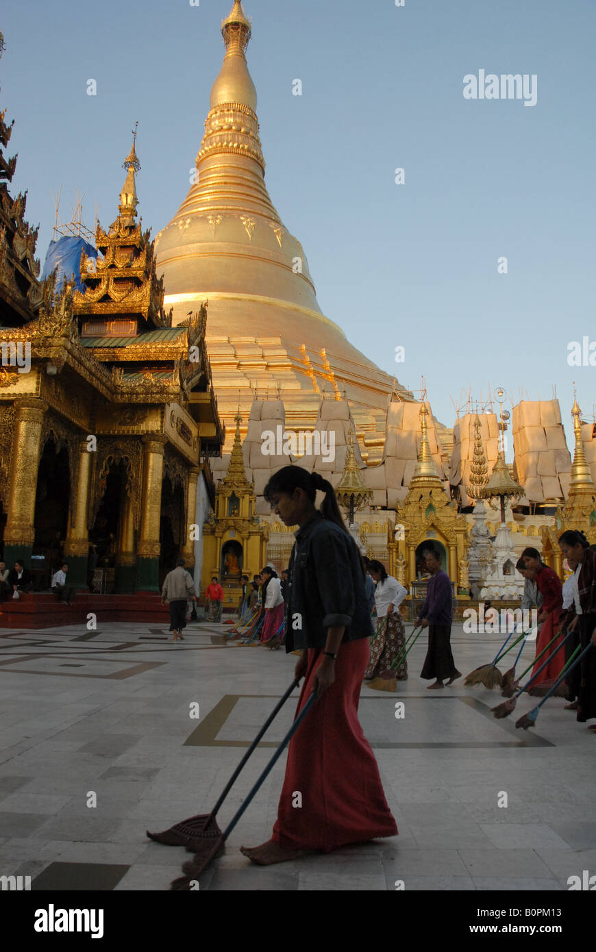 burmese people are sweeping dust at shewedagon pagoda, rangoon, burma Stock Photo