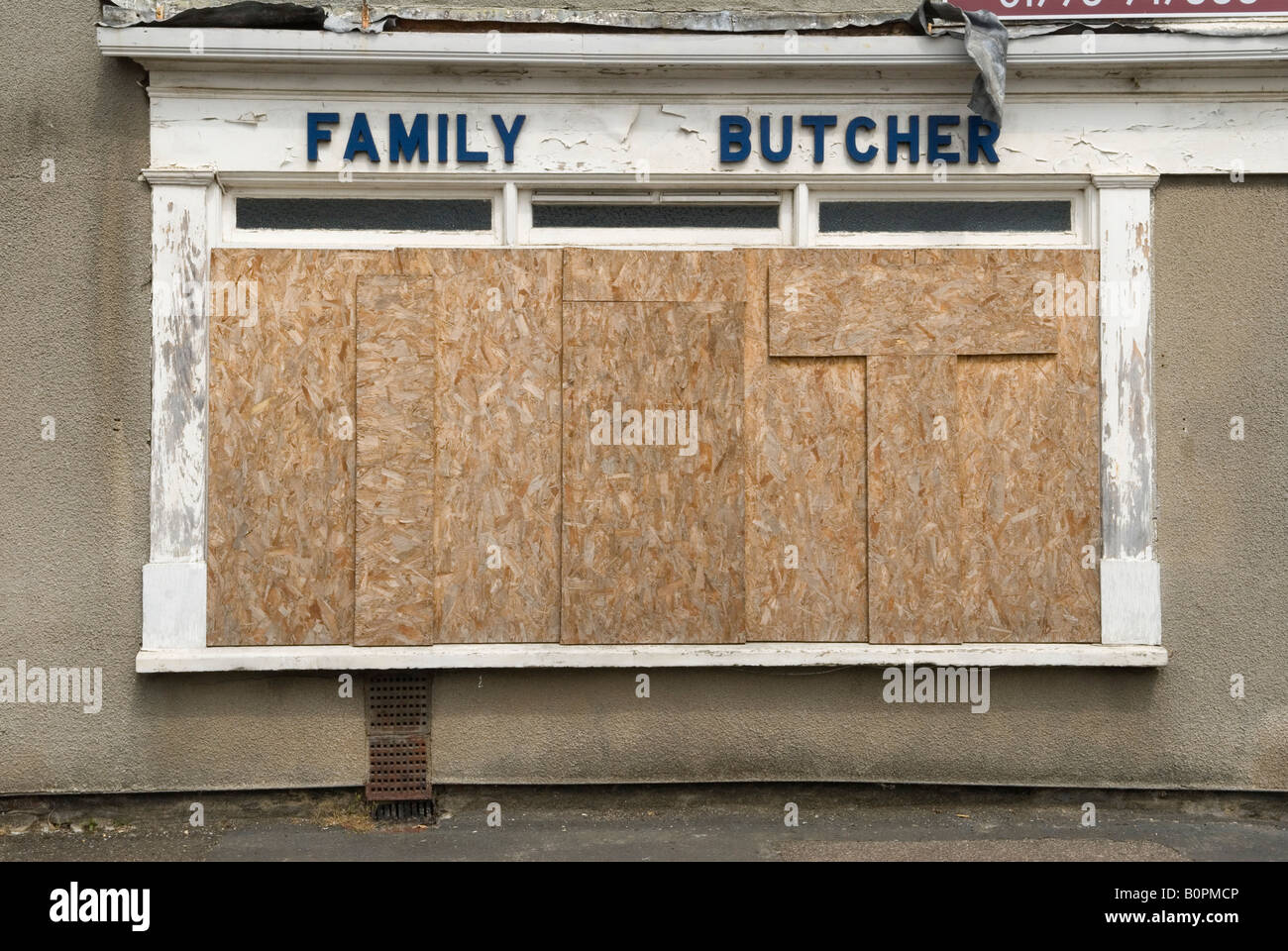 Rural economy family butchers corner shop boarded up closed down, Sutton Bridge Lincolnshire UK 2008 2000s HOMER SYKES Stock Photo
