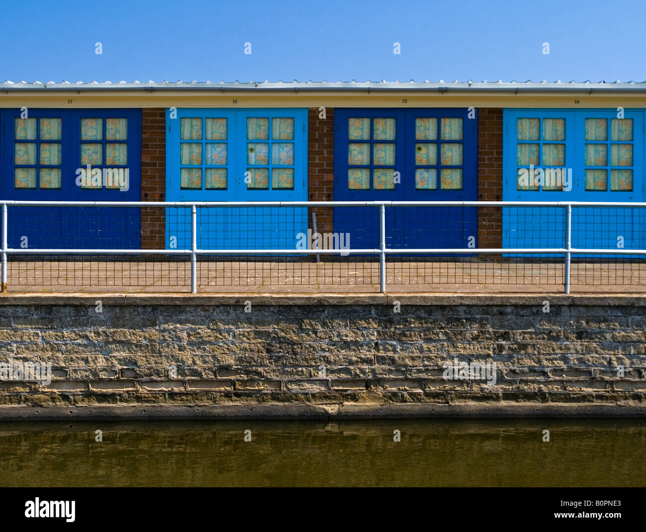 Blue painted beach huts at Skegness Lincolnshire England UK Stock Photo