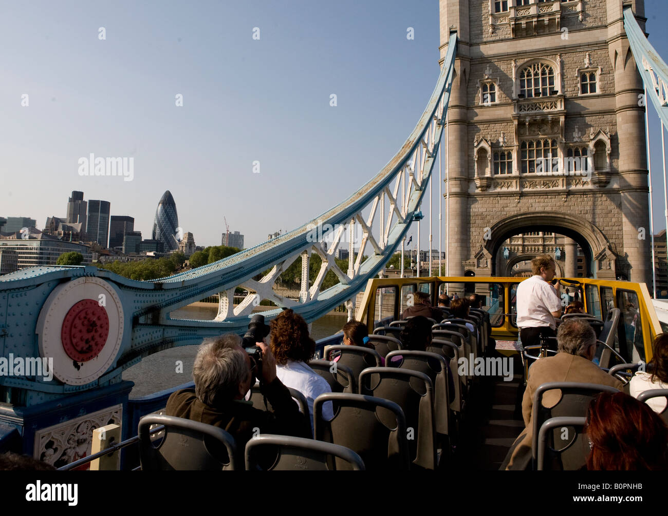 An Open Top Tourist Bus Crossing Tower Bridge London UK Europe Stock Photo