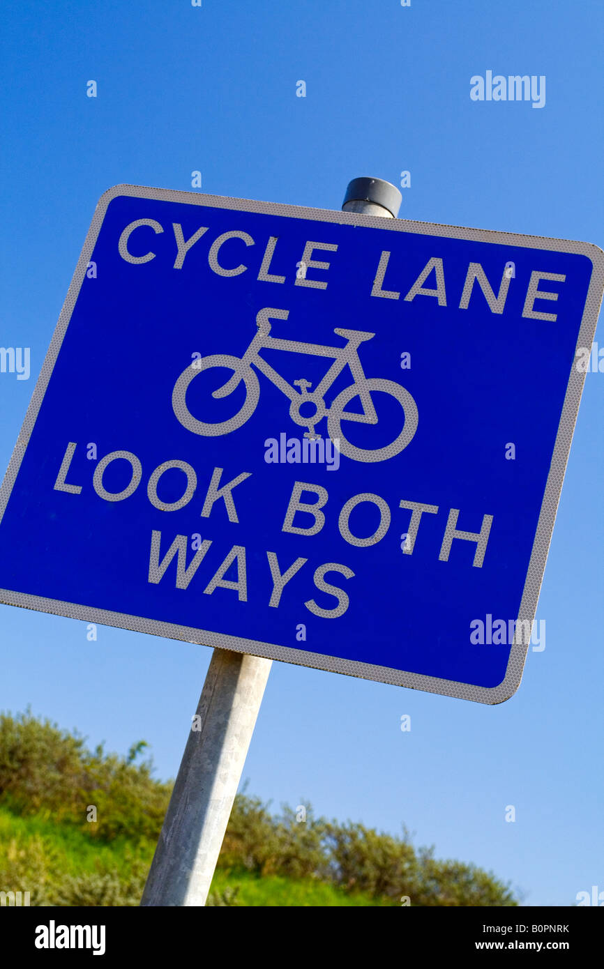 Cycle lane sign on a UK cycle path with blue sky behind Stock Photo Alamy