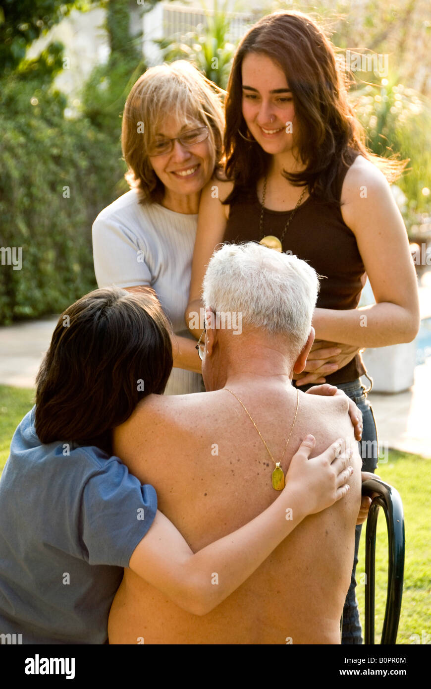 Grandfather daughter and brother and sister have a chat by the pool Sao  Paulo Brazil 09 22 07 Stock Photo - Alamy