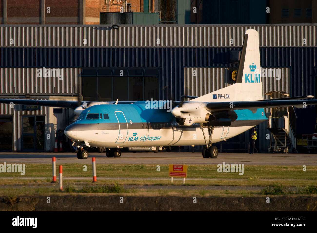 Commercial aircraft Fokker 50 KLM taxiing at London City Airport, England, UK Stock Photo