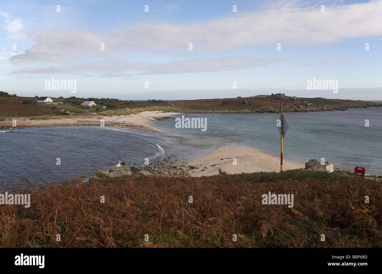 The Island of Gugh viewed from the Scilly Island of St Agnes UK is connected by a tidal causeway called The Bar isles of scilly Stock Photo