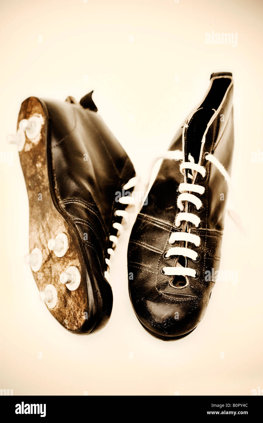 Vintage football boots shot in sepia Stock Photo - Alamy