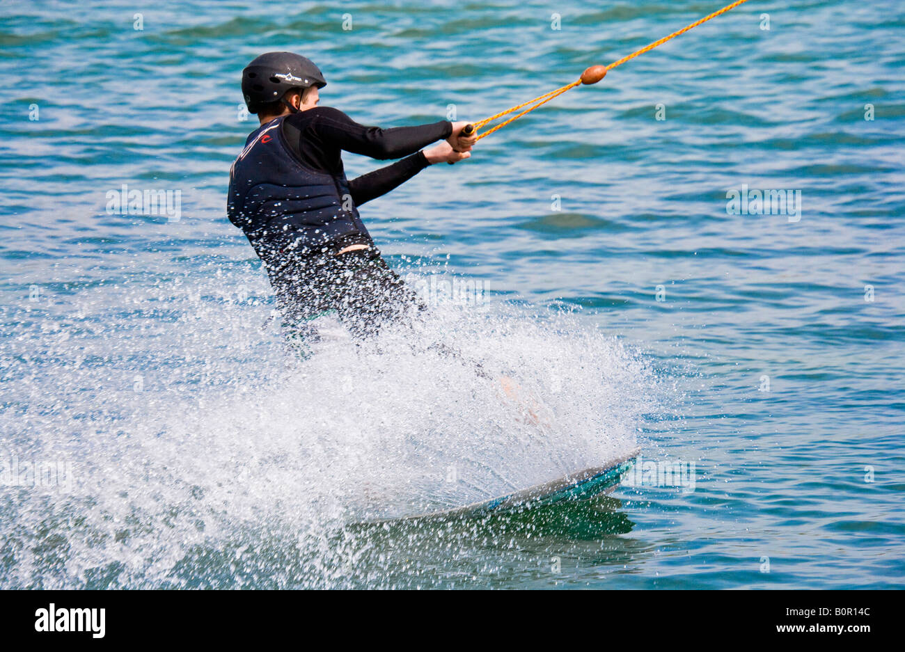 Man cable water skiing or waterboarding. Stock Photo