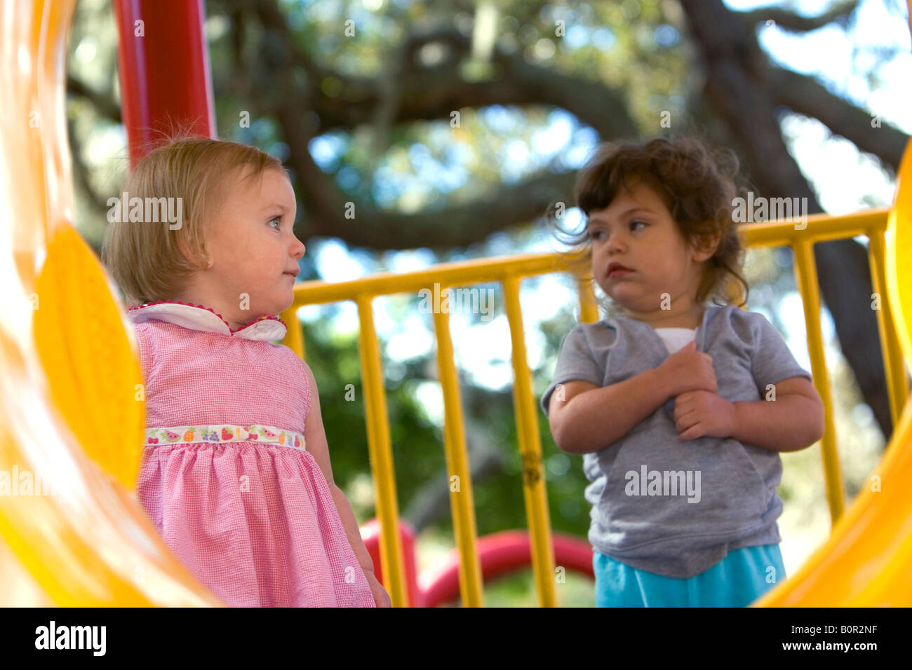 Young girls on playground equipment in Tampa Florida Stock Photo