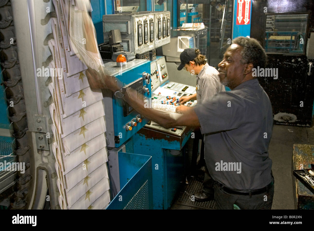 Pressmen in the control room for the rotary printing press at the Houston Chronicle in Houston Texas Stock Photo