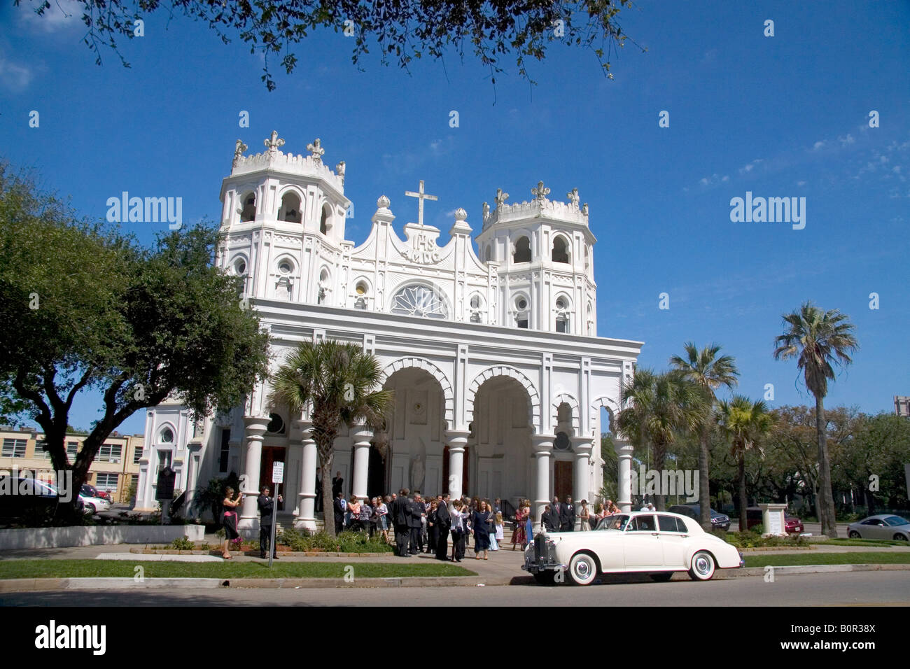 Wedding party outside the Sacred Heart Church in Galveston Texas Stock Photo