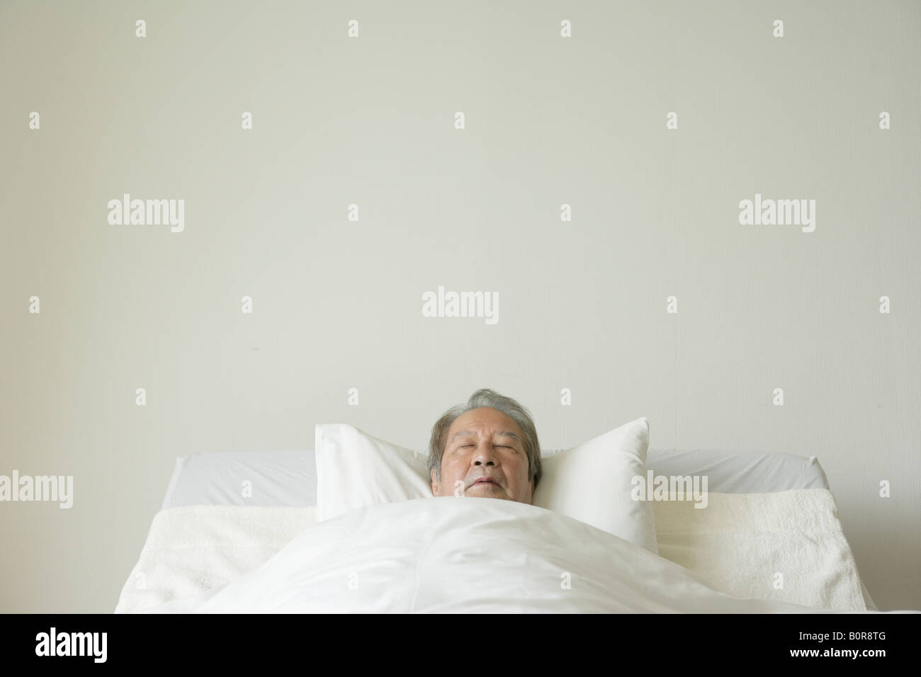 senior man sleeping in bed Stock Photo - Alamy