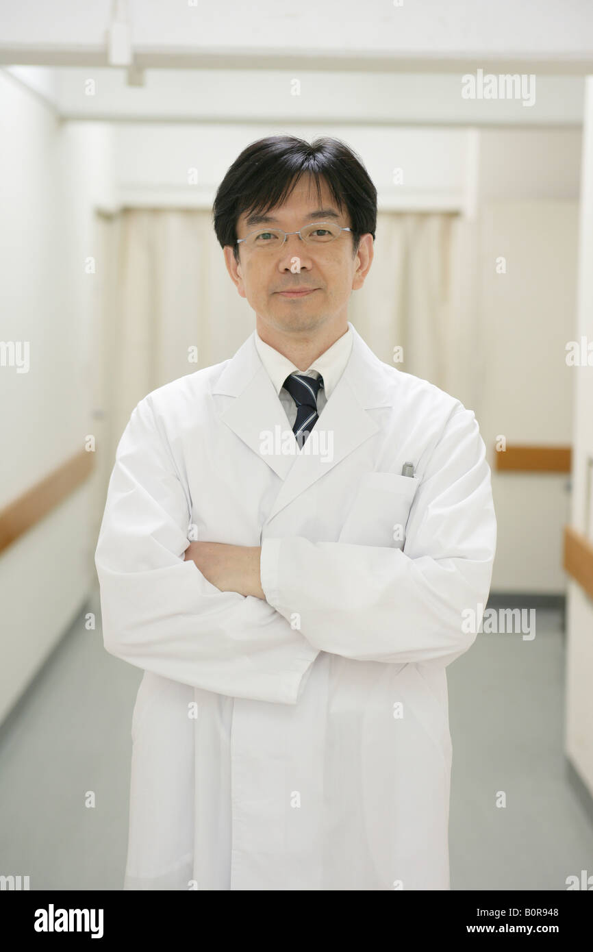 Portrait of male doctor in hospital corridor Stock Photo - Alamy