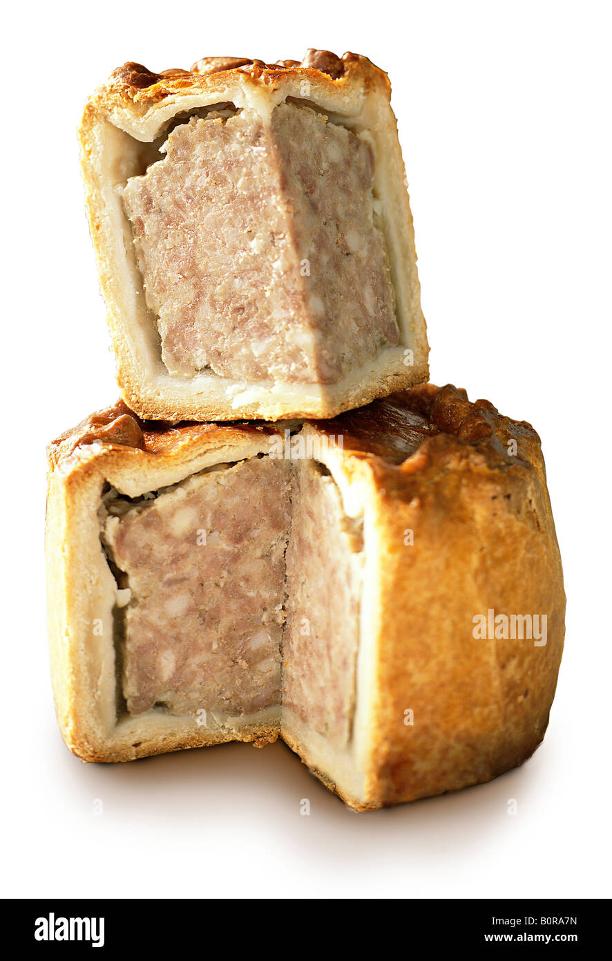 traditional english pork pie cut out stack cut meat reflection golden pastry Stock Photo