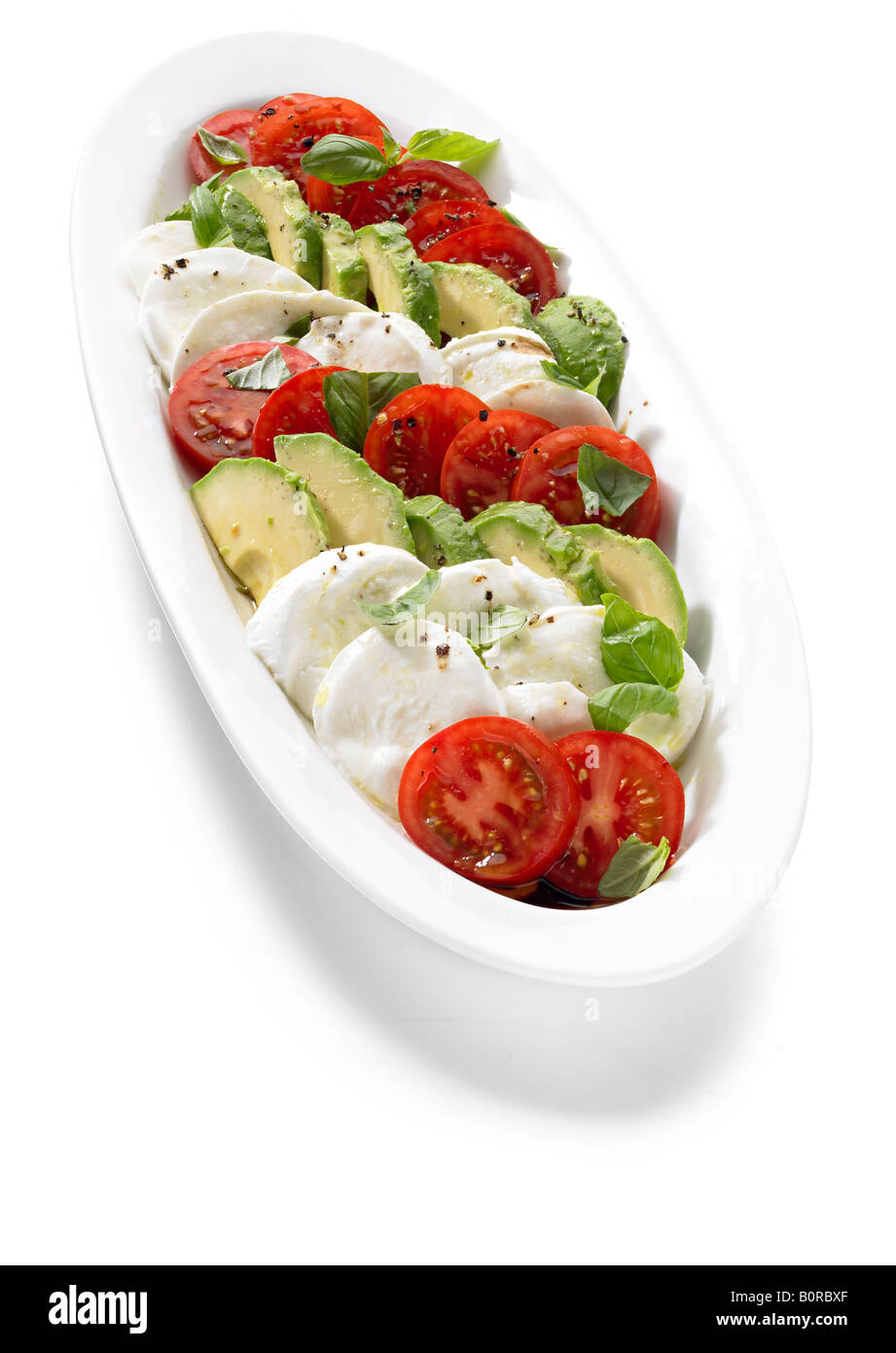 tri-colore salad Italian food three colour mozzarella avocado tomato Stock Photo