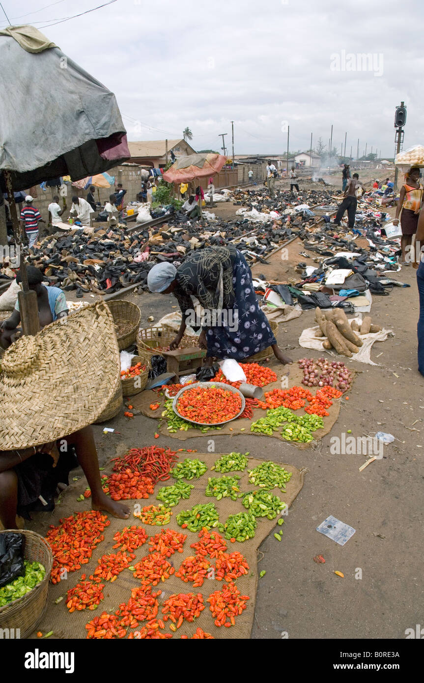 Accra train station squatters sell vegetables on the stations tracks, Ghana Stock Photo