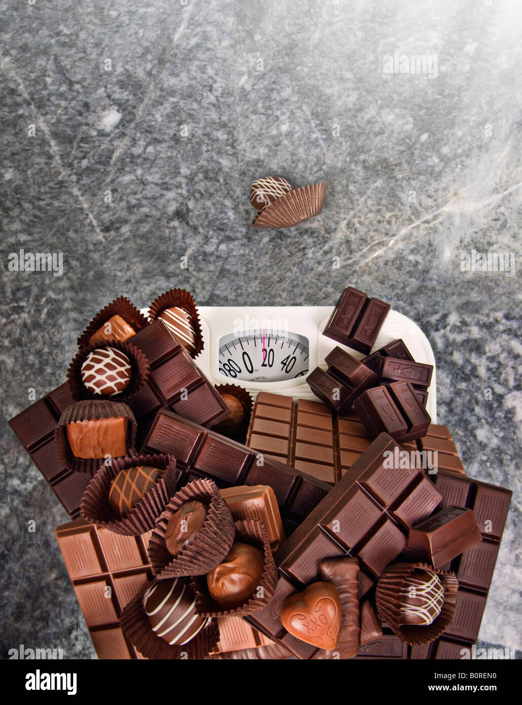 chocolate candy on a bathroom scale Stock Photo