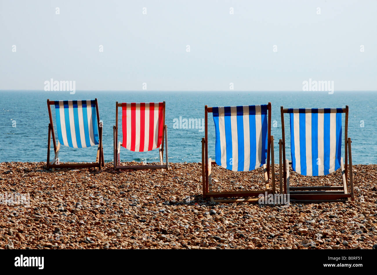 Deckchairs on Brighton beach, UK Stock Photo Alamy