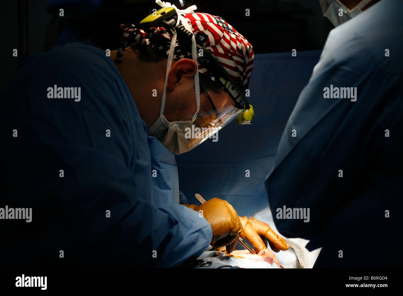 A surgical team operates on a patient during a 2006 surgical mission to Sula Santa Barbara hospital in Honduras October 31 2006 Stock Photo