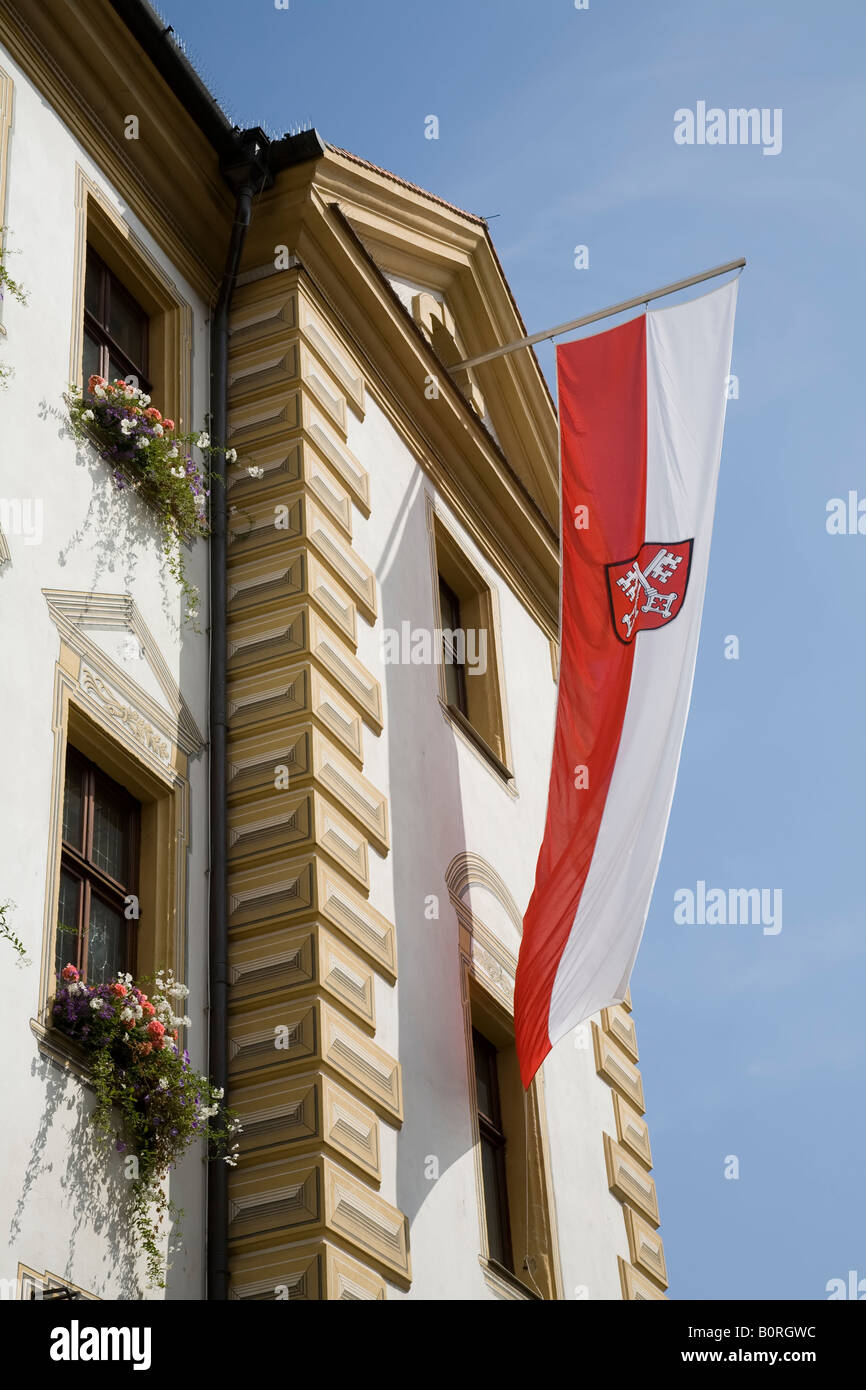 German government vertical flag flying on town hall Regensburg Germany Stock Photo