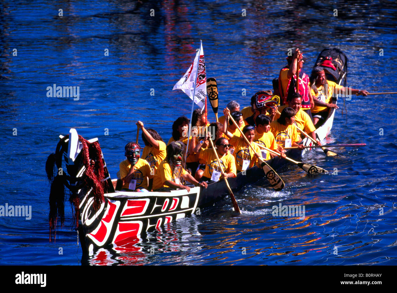 Native American Indians canoeing in a Traditional Dugout Canoe at the Indigenous Games in Victoria British Columbia Canada Stock Photo