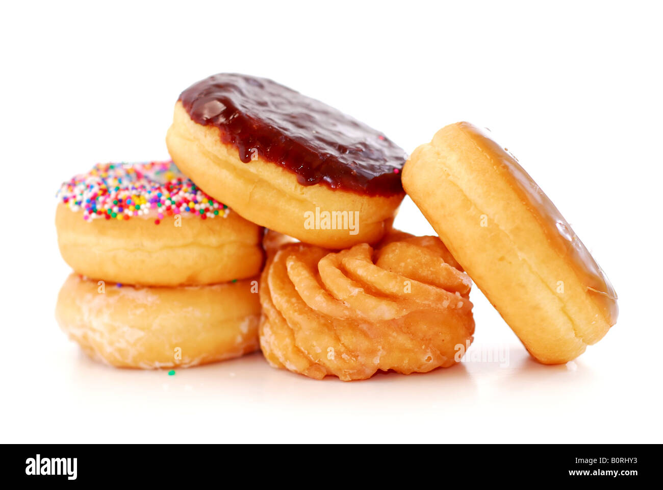 Pile of assorted donuts isolated on white background Stock Photo - Alamy