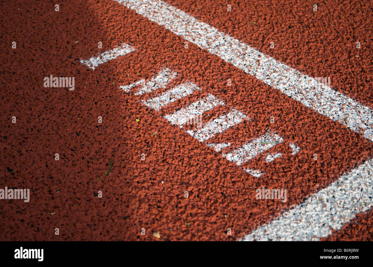 Track and field 1 mile marker Stock Photo Alamy