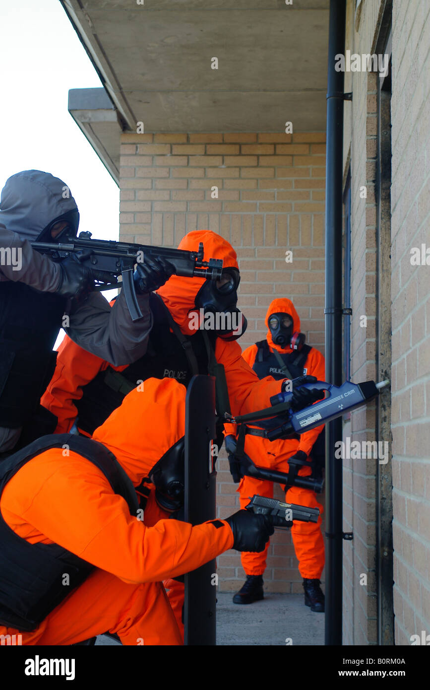 Police firearms officers training in CBRN PPE Stock Photo