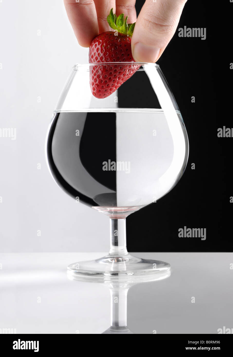 Adding a strawberry Stock Photo