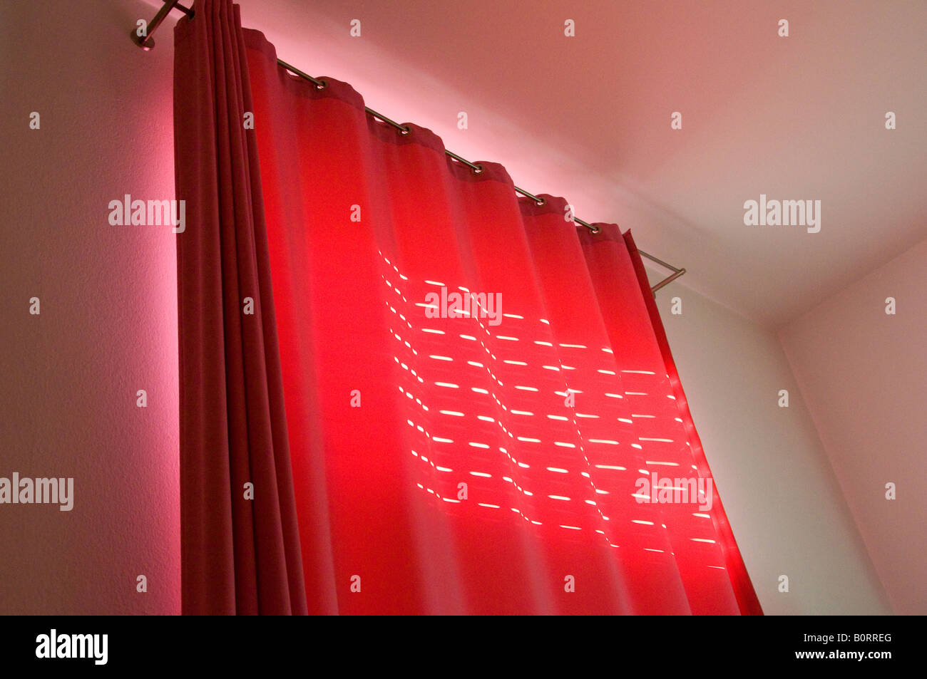 Red curtain in a hotel room Munich Germany Stock Photo