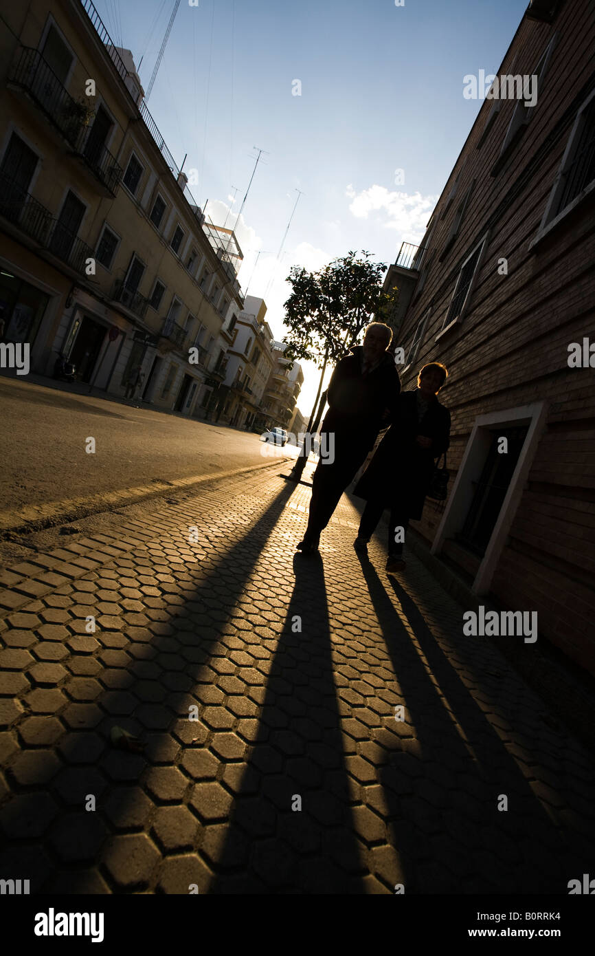 Strongly backlit people, Seville, Spain Stock Photo - Alamy