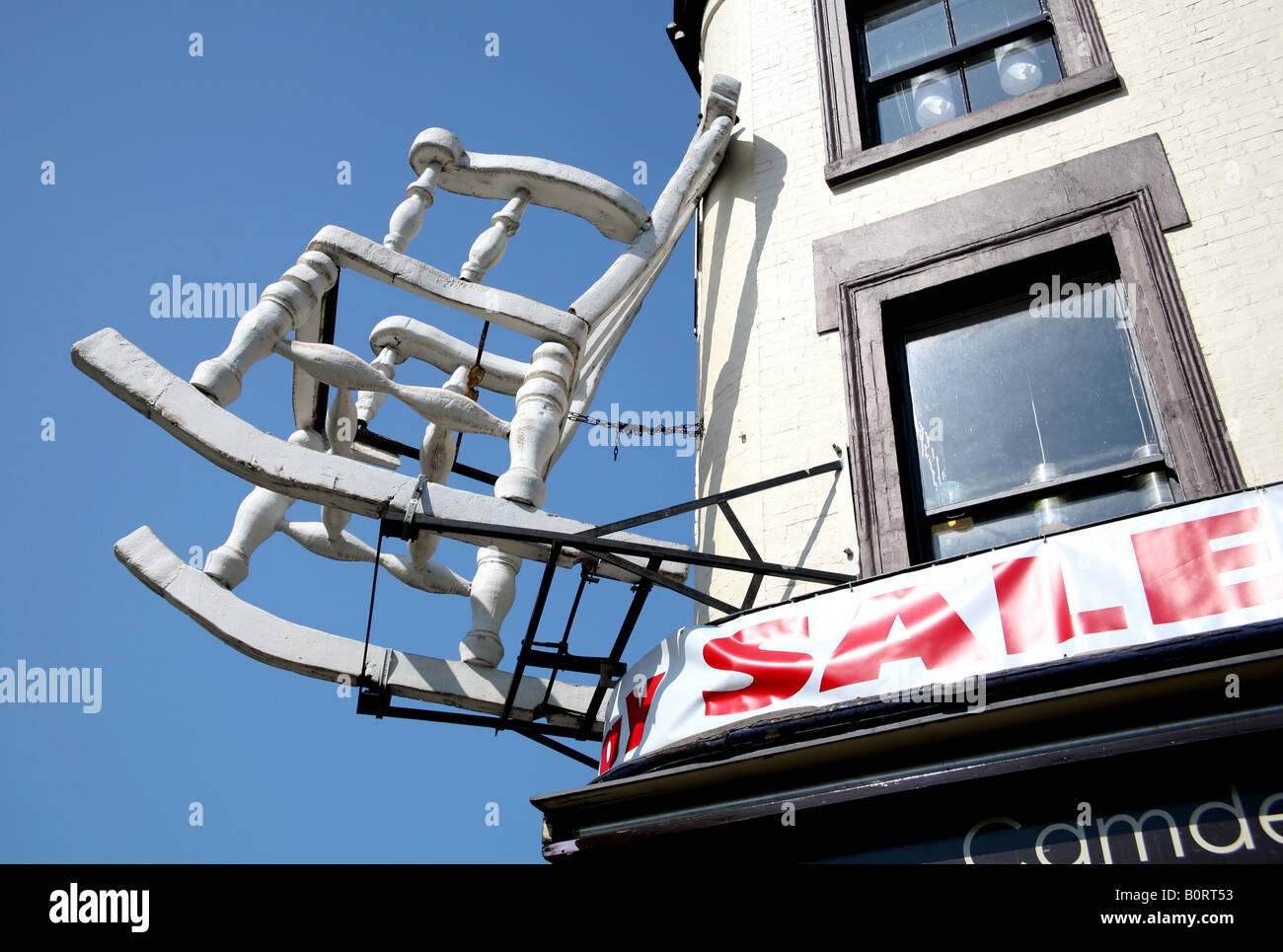 Giant chair affixed to shop building in Camden Town London Stock Photo