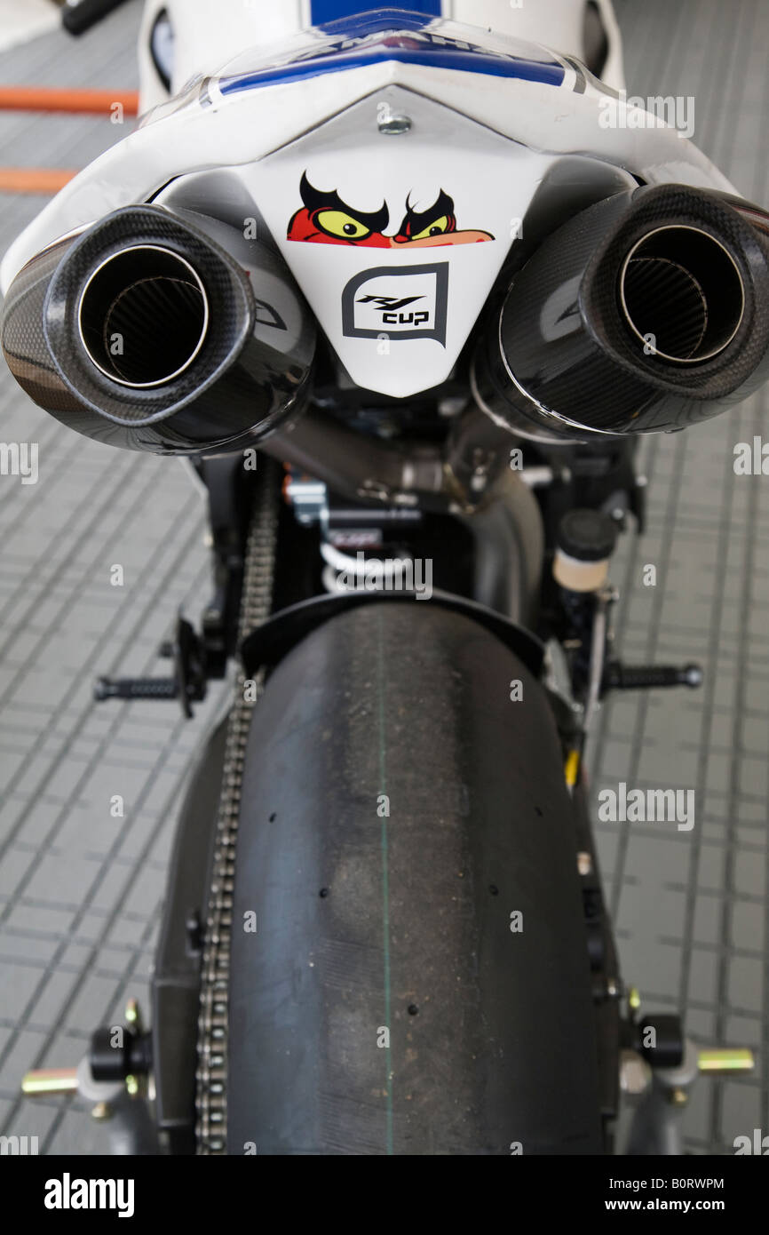 The rear view of a Yamaha R1 motorcycle awaiting its rider in the Henderson Yamaha R1 Cup at Brands Hatch, Kent, England. Stock Photo