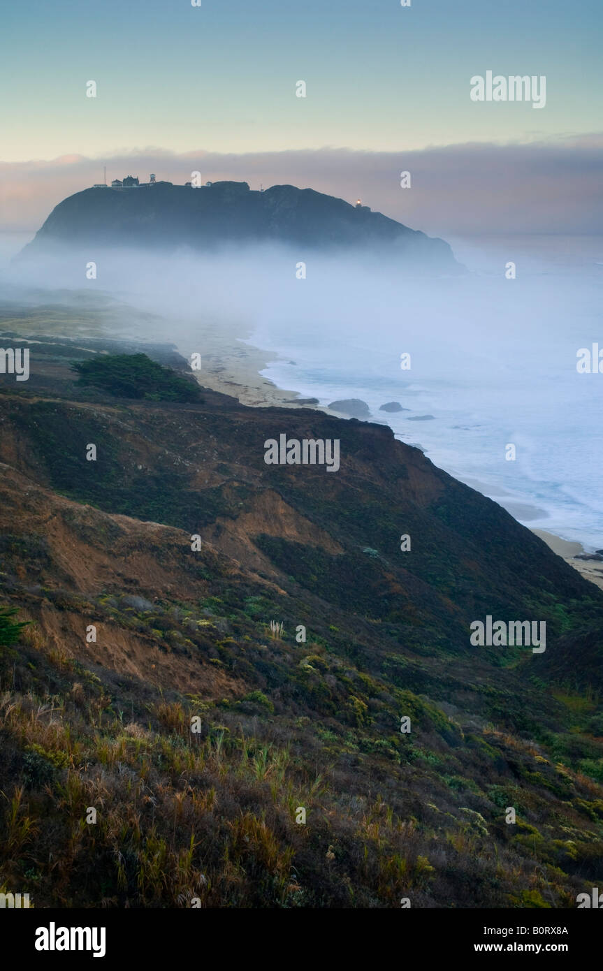 Point Sur Lighthouse and morning fog at sunrise Big Sur Monterey County coast California Stock Photo