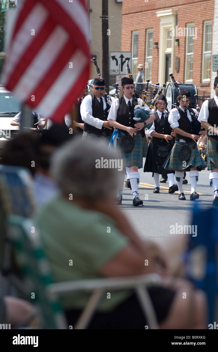 Bagpipe music players march in small town patriotic parade Stock Photo Alamy