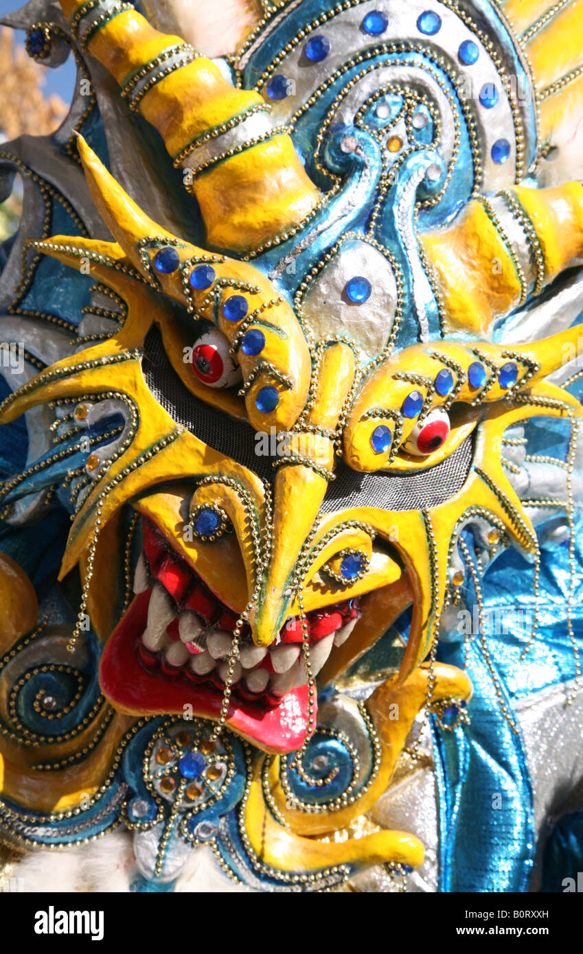 Carnival participant wearing fancy dress of Diablo Cojuelo performs
