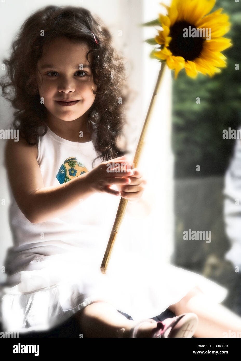 Girl with sunflower Stock Photo - Alamy