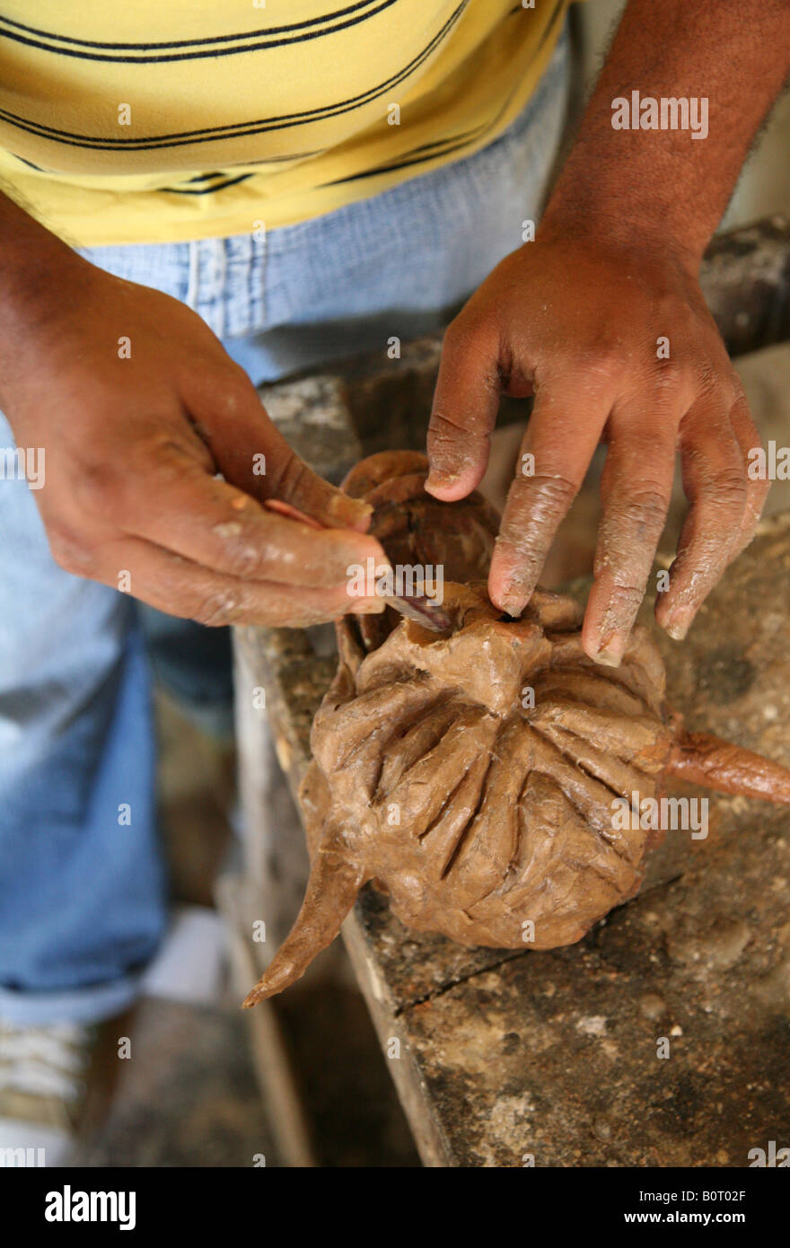 Dominican maskmaker in his workshop prepares carnival masks Diablo