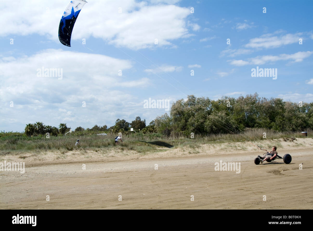kite buggy wind power powered car beach speed fast drag dragged along