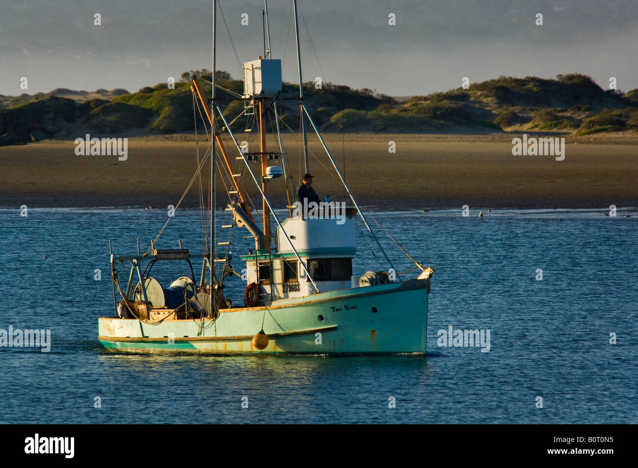 Commercial fishing boat heading out to sea from Morro Bay ...