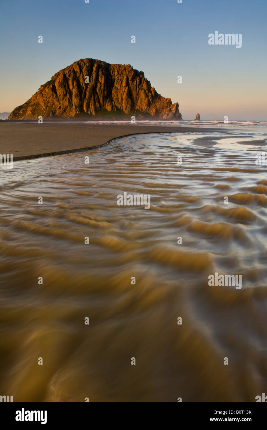 Sunrise light on Morro Rock over Little Morro Creek Morro Strand State