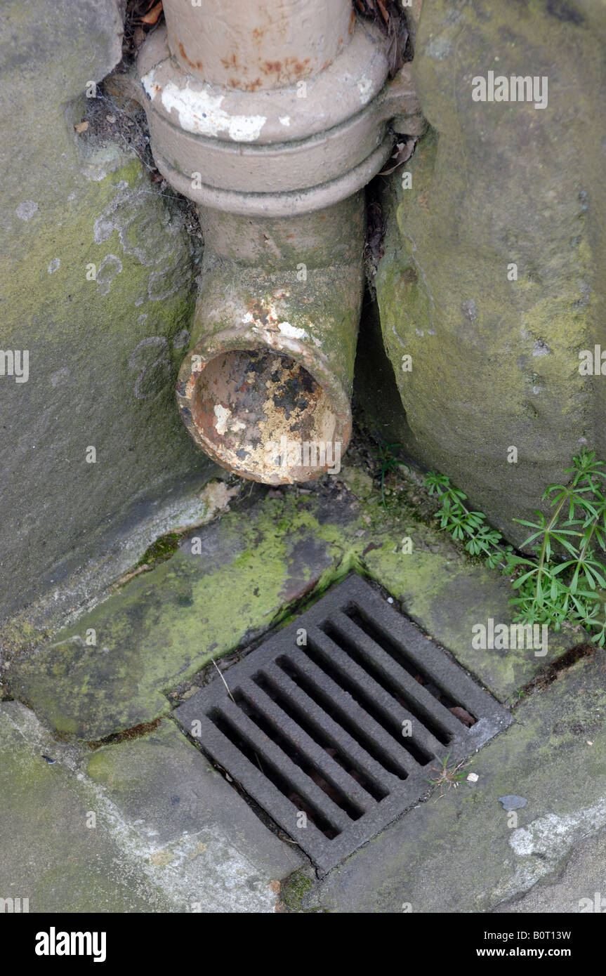 Cast iron fall pipe shoe and grate Stock Photo